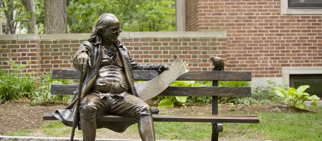 Statue on bench