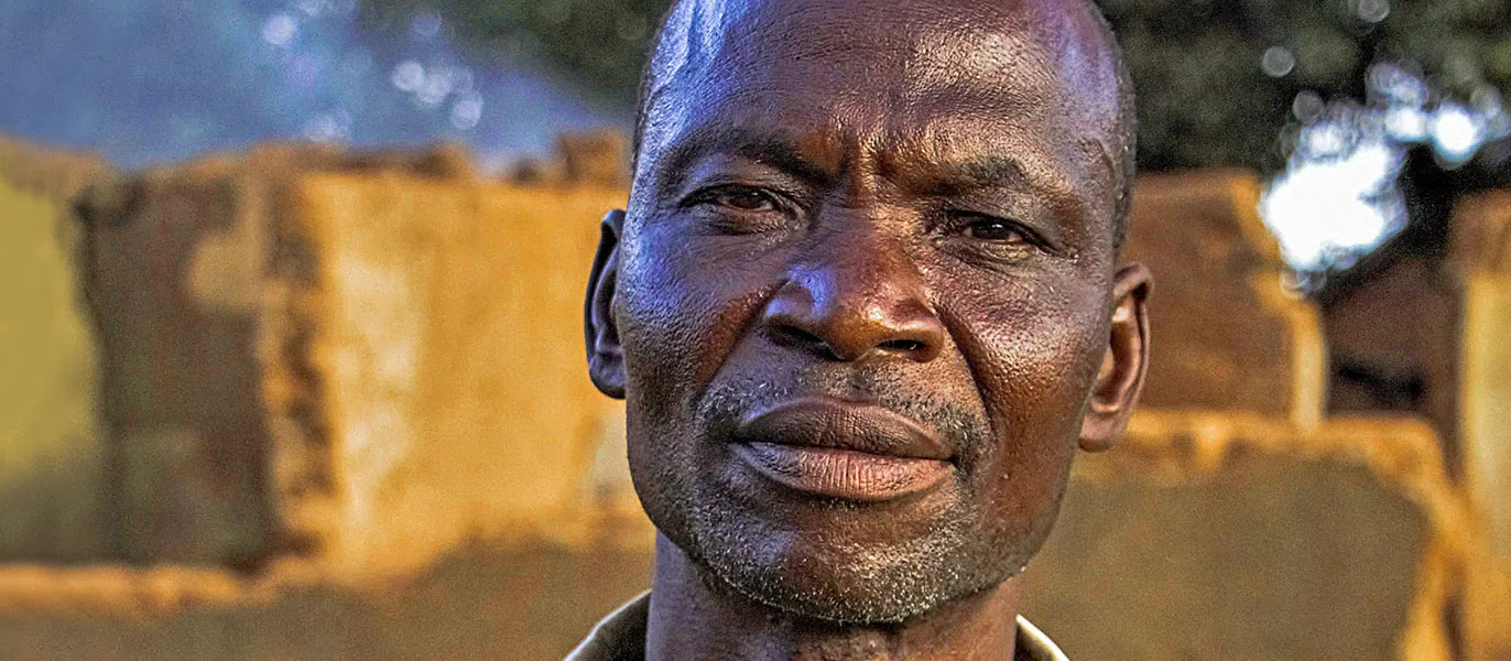 Man looking straight into camera with neutral expression