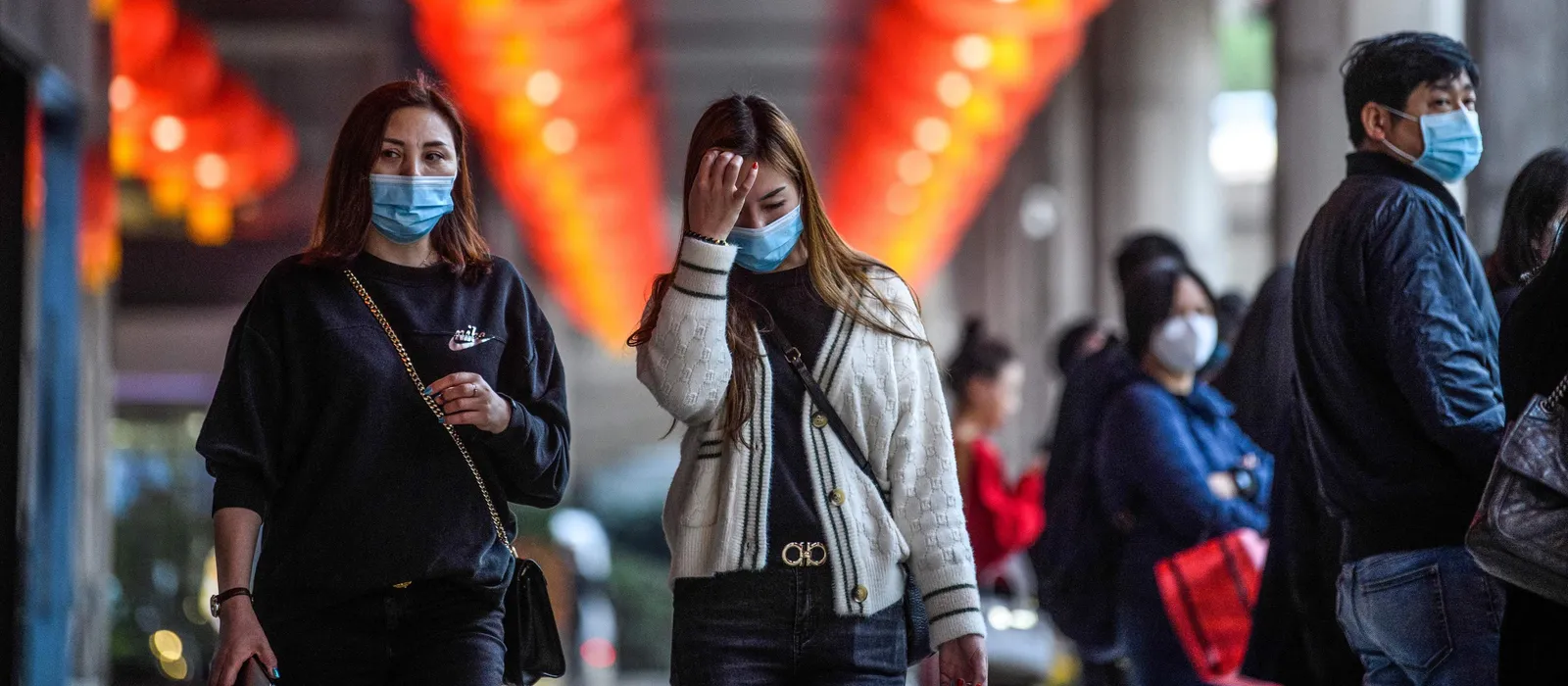 Women walking with masks on