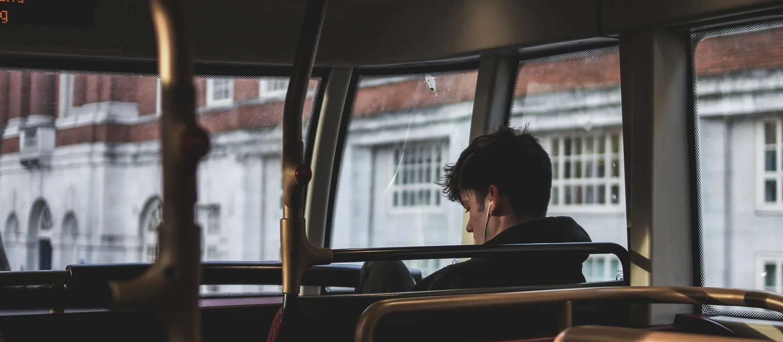 Boy on bus with headphones in